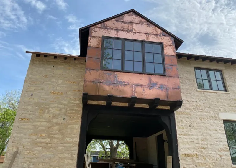 Copper metal panel facade on a stone building for Metal Roof Coating in Rodeo